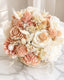 Bouquet of pink and white flowers on a marble surface