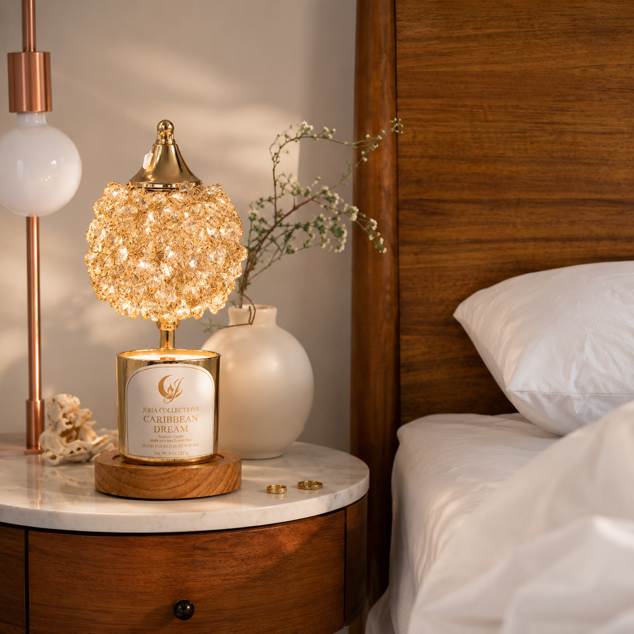 Decorative lamp on a nightstand next to a bed with wooden headboard