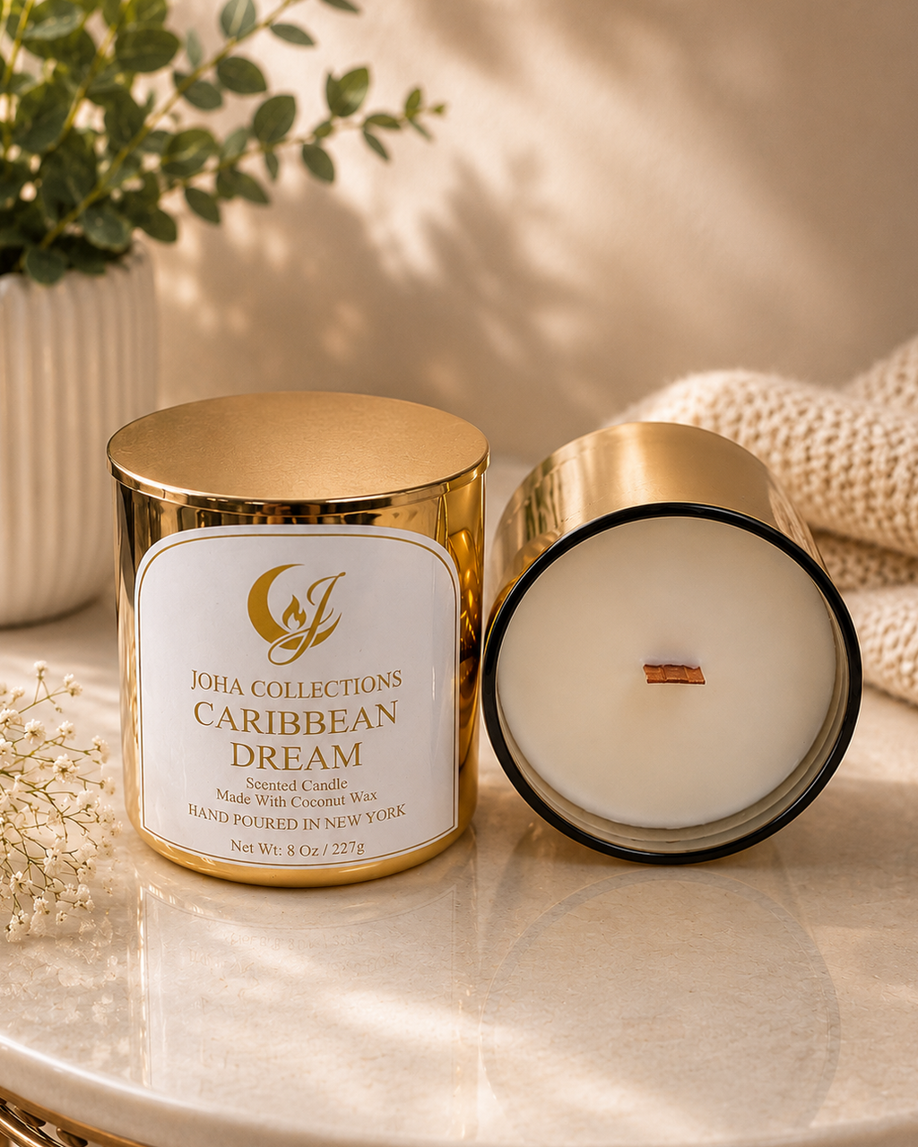 Igha Collections Caribbean Dream candle on a marble surface with a gold lid