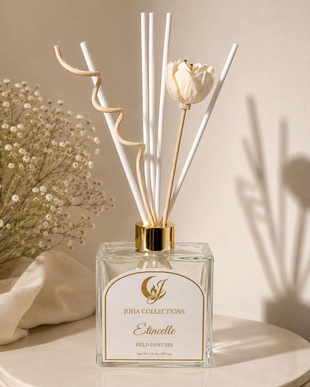 Reed diffuser with decorative elements on a neutral background